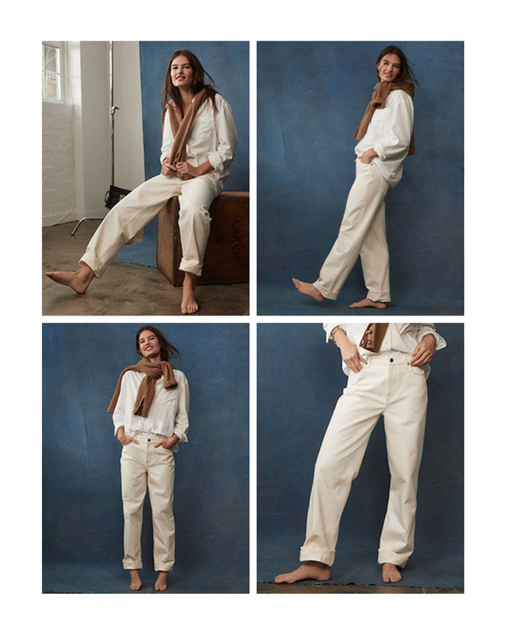 Woman in white jeans. Image link to Mid rise relaxed jeans.