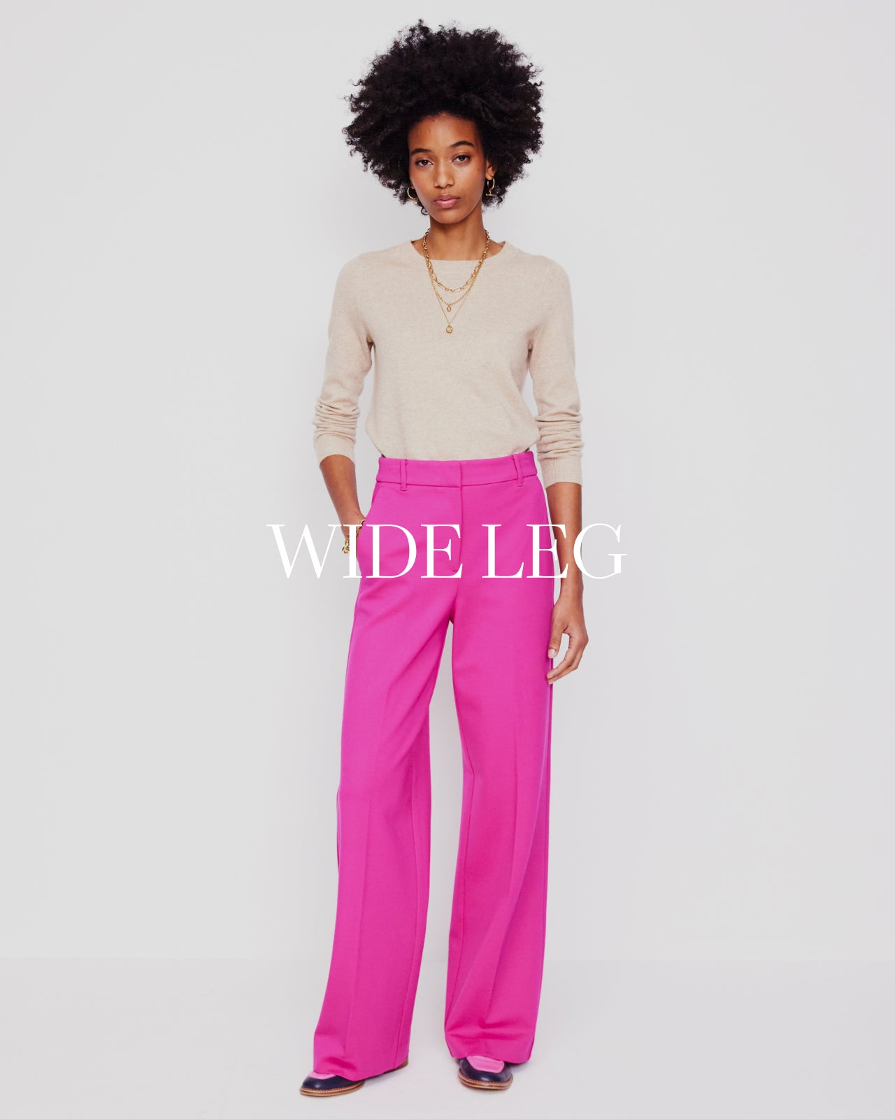 Women wearing pink wide leg trousers 