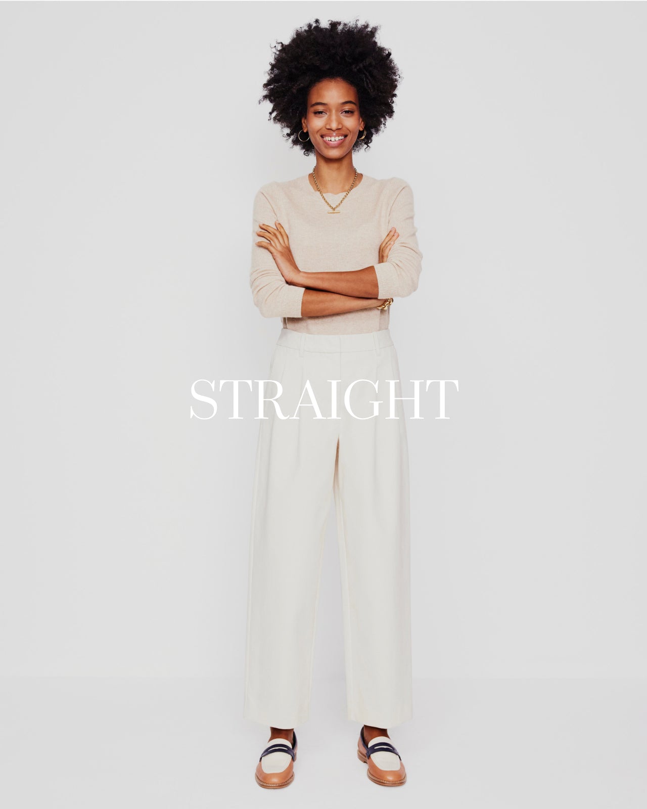 Women wearing white straight leg trousers 
