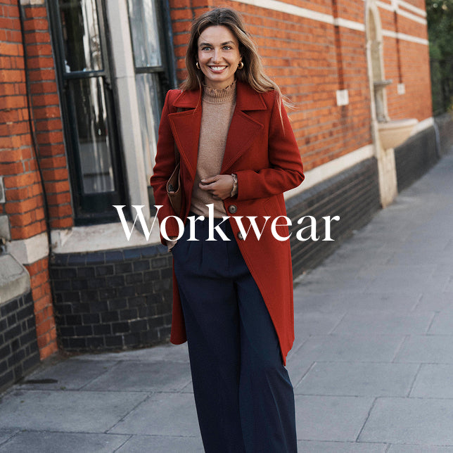Woman in a red coat standing on a street with 'Workwear' text overlay.