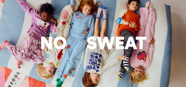 Children wearing pajamas with text 'NO SWEAT' on a colorful background