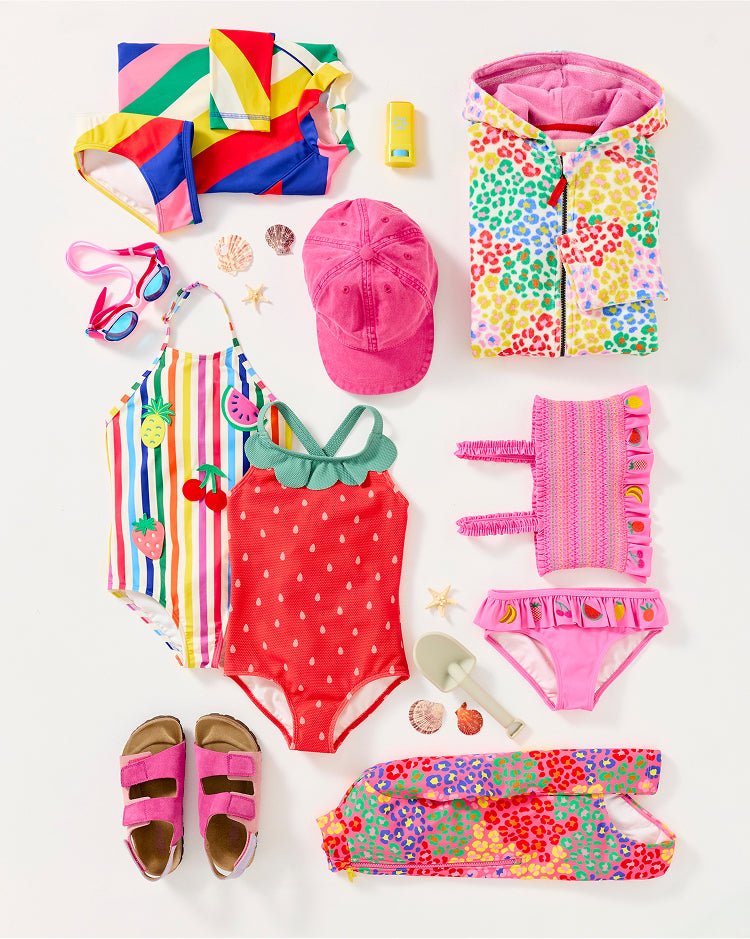 Colourful girl's Boden clothing, folded and ready to be packed for summer camp