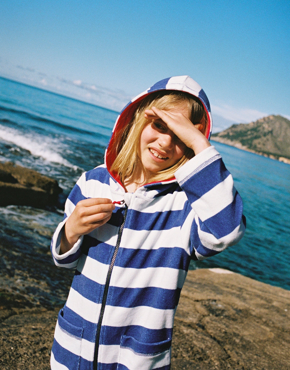 Boy wearing striped Boden towelling jackets
