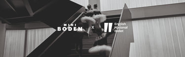 Collaboration between Mini Boden and English National Ballet with a dancer in a tutu on a staircase.