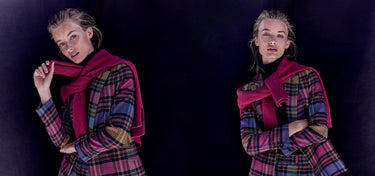 Woman wearing a plaid outfit with a purple scarf against a black background