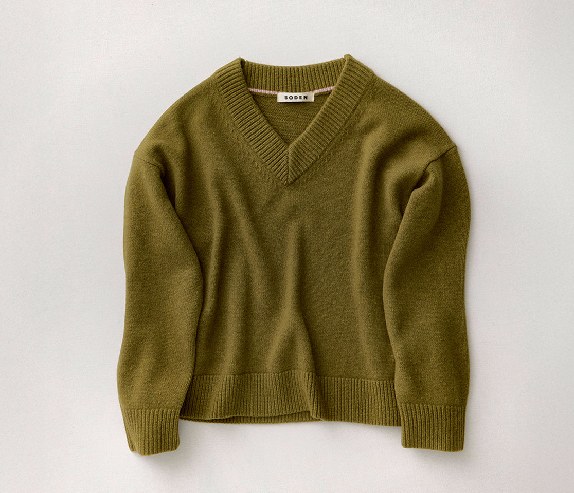 Green sweater on a white background