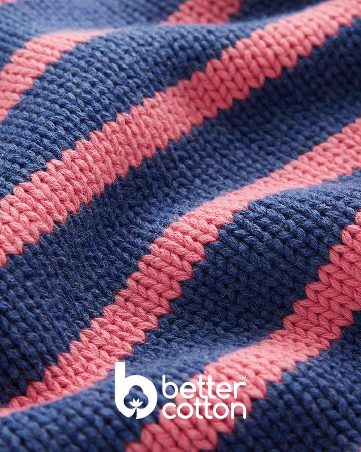 Close-up of blue and pink striped fabric with 'better cotton' logo.