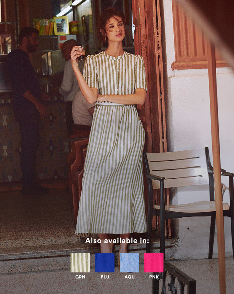 Woman in a striped dress standing in a casual setting with color swatches below.