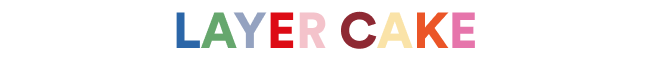 Colorful text 'LAYER CAKE' on a white background