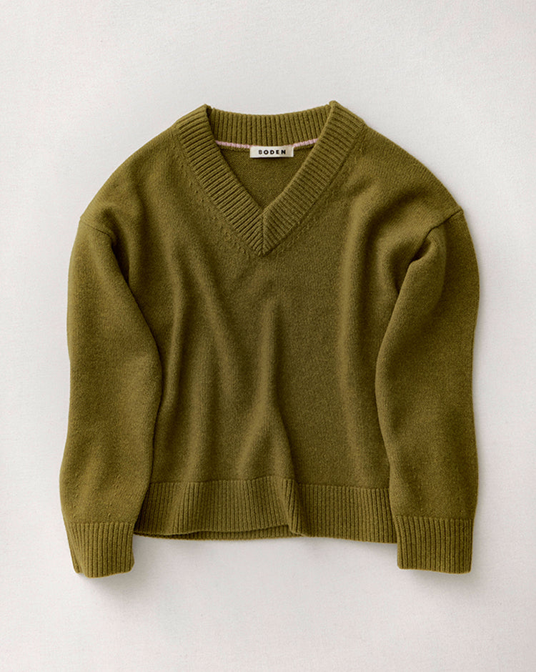 Green sweater on a white background