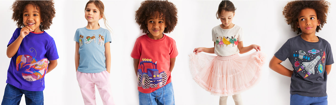 Five children wearing different Boden superstitch t-shirts