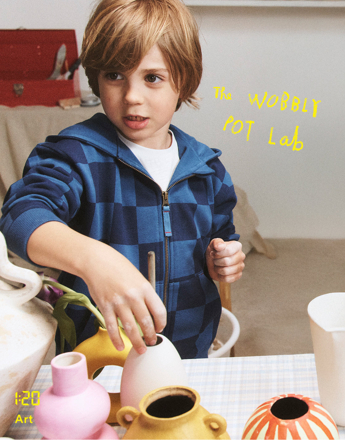 Child playing with colorful vases on a table, with text 'Building wobbly pots like the Romans' on a light background.