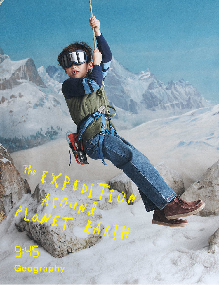 Child in mountainous landscape with text 'The Expedition Around Planet Earth 945 Geography'