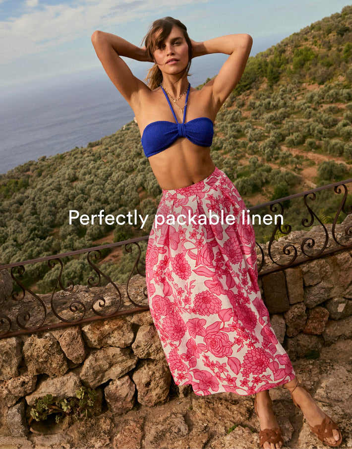 Image text: Perfectly packable linen. Image link to Verity Linen Midi Skirt.