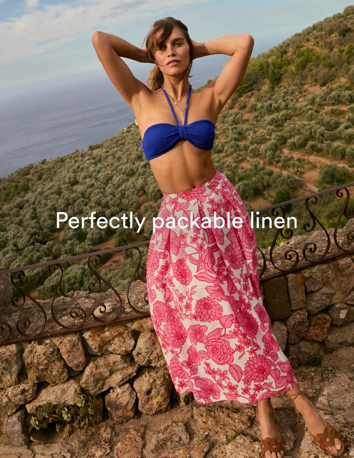 Image text: Perfectly packable linen. Image link to Verity Linen Midi Skirt.