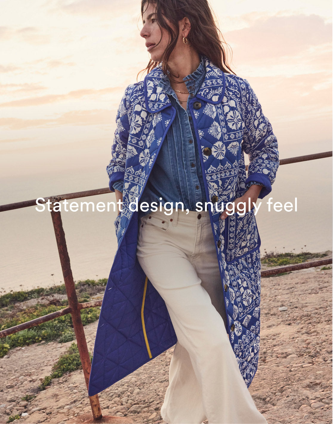 Woman wearing Boden quilted coat, caption "Statement design, snuggly feel", linking to Soft Quilted Coat - Bright Blue, Ornate Stripe