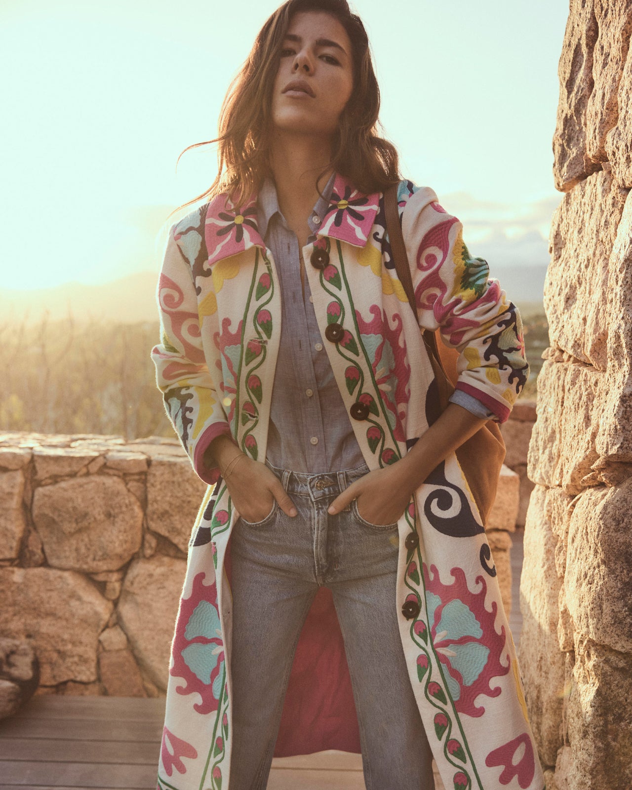 Woman wearing colorful coat. Image link to womens coats.